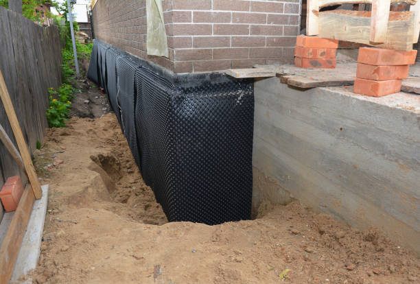 SJ Waterproofing Pros technician performing targeted Waterproofing assessment in Westport, IN